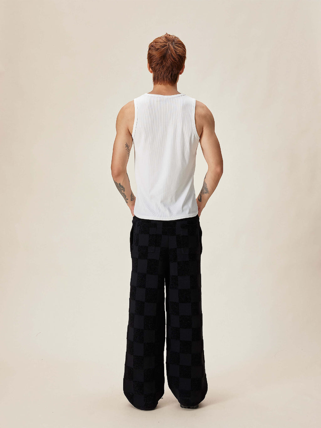EVILKNIGHT(EK) Jacquard Logo Plaid Knit Pants