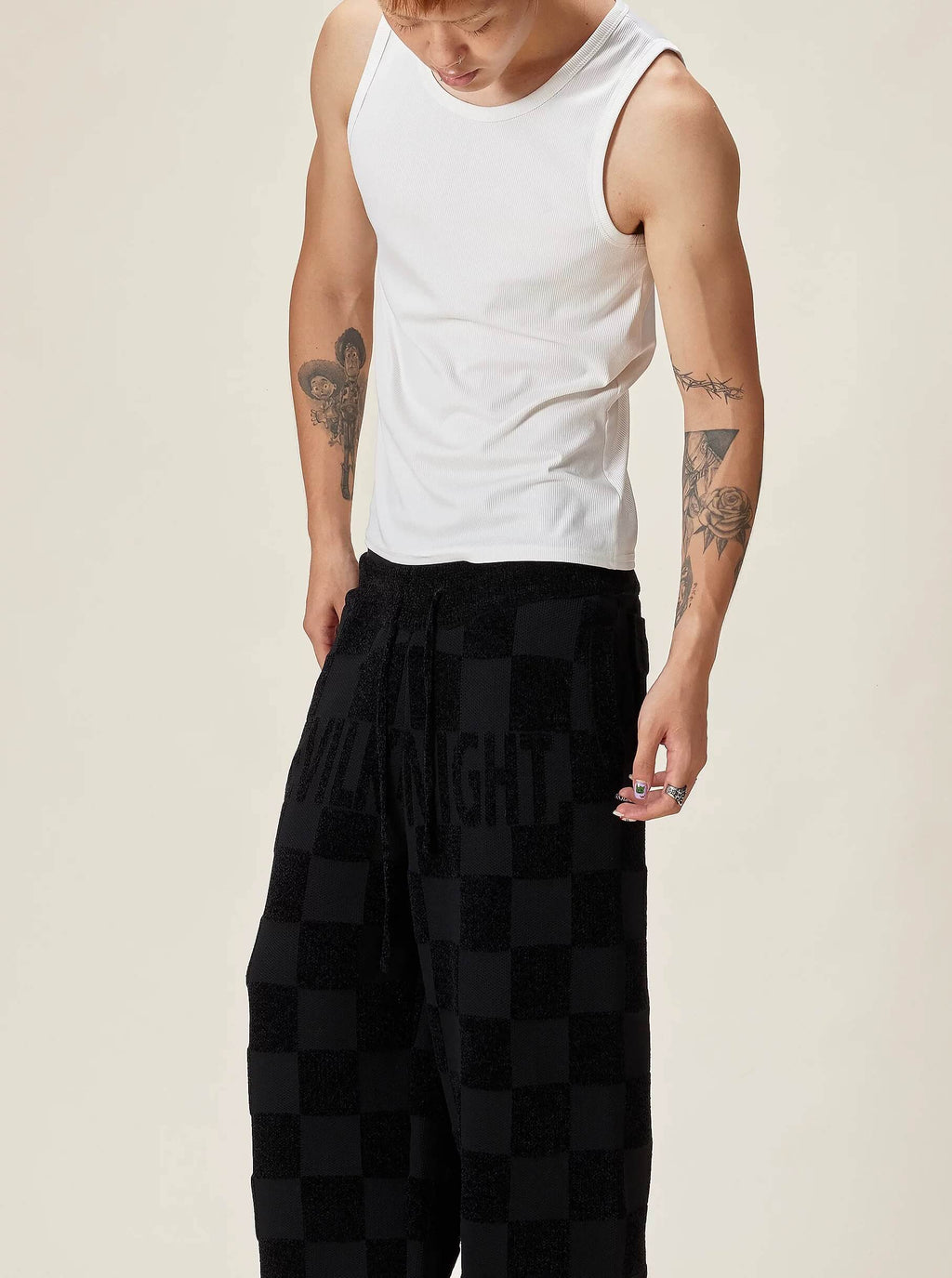 EVILKNIGHT(EK) Jacquard Logo Plaid Knit Pants