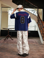 Harsh and Cruel Colorblock Number Embroidered Polo