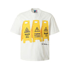 YADcrew “Love Caution Seal” Print Tee