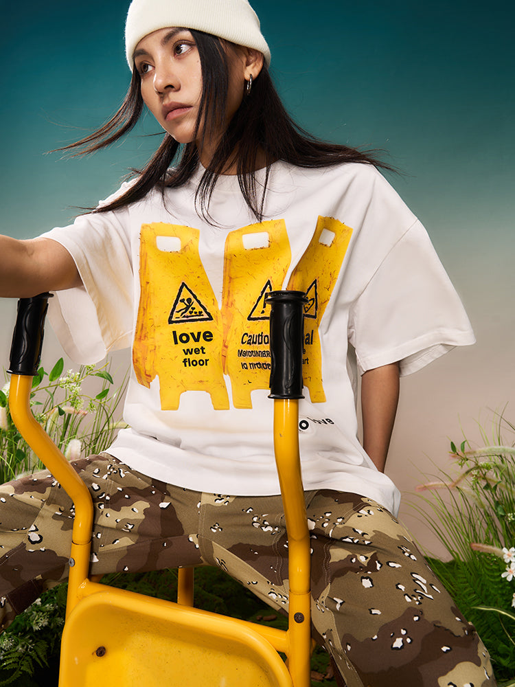 YADcrew “Love Caution Seal” Print Tee